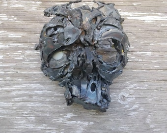 Welded metal sculpture wall mask