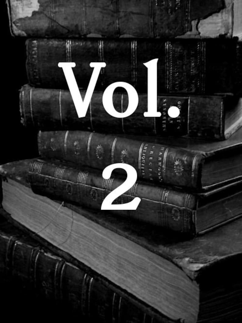 May include: A stack of old, black, leather-bound books with the text "Vol. 2" printed in white on the top book.