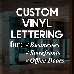 May include: White custom vinyl lettering applied to a glass surface. The text reads: CUSTOM VINYL LETTERING for: Businesses, Storefronts, Office Doors. Each line is preceded by a white checkmark symbol, creating a clear and professional display.