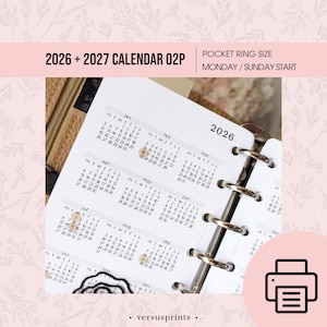 May include: A white 2026 and 2027 calendar insert for a pocket ring binder. The calendar pages are open to display the months of January through December. The text "2026 + 2027 CALENDAR 02P" is at the top.