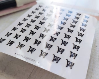 May include: A white sticker sheet featuring a grid of small, black shopping cart icons. The bottom left corner of the sheet displays the text versusprints in a small, simple font. The stickers have a glossy finish and are arranged in rows.