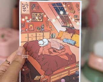 May include: A rectangular art print featuring a warm-toned illustration of an attic bedroom. The scene depicts a bed with a sleeping white cat, a laptop, and headphones. String lights hang above, and the room includes a dresser, books, and a window showing a night sky with stars.