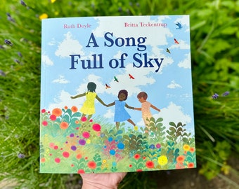 Una canción llena de cielo — libro de bolsillo — firmado por el autor