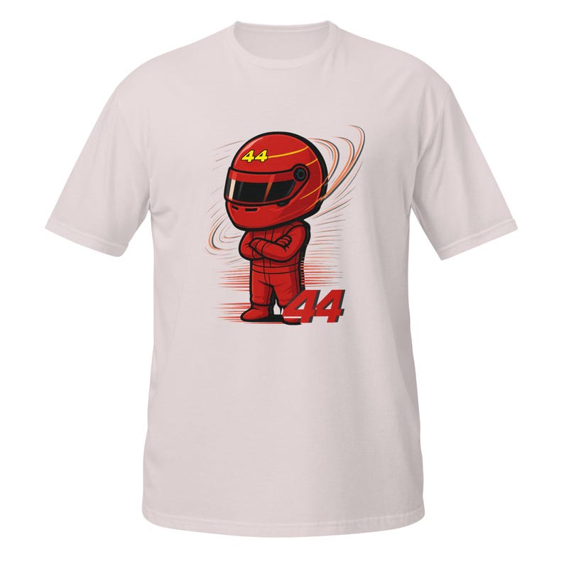 white tee flat-lay with the red chibi racer graphic and "Lewis Hamilton" text, front view with visible fabric texture.