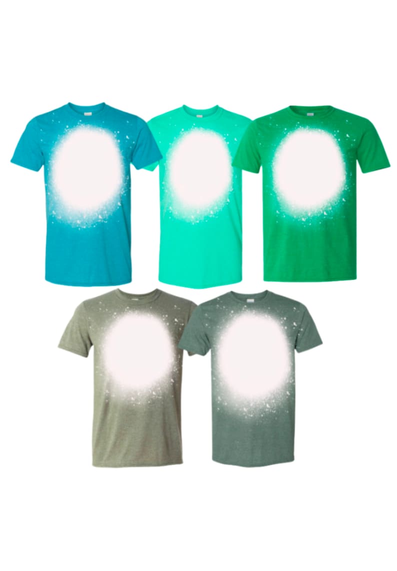 May include: Five t-shirts in different colors with a white circle spray painted on the front. The shirts are teal, green, light green, olive green, and dark green.