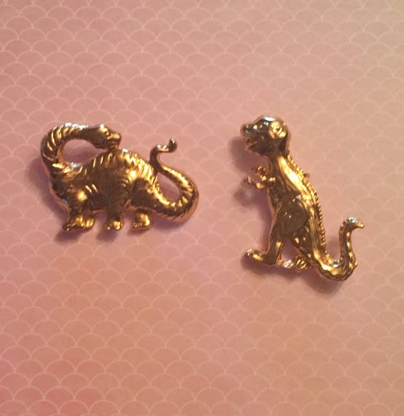 Dinosaur brooches
