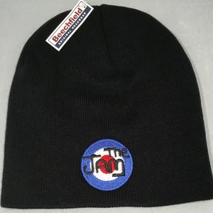 May include: Black beanie with a blue, white and red The Jam logo embroidered on the front. The logo features a target design.