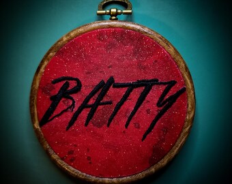 Getailleerde geborduurde hoepel