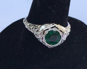 Edwardian 18k white gold lovebird design ring with emerald paste center stone engagement promise anniversary ring circa 1900.
