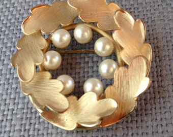 Richelieu goldtone faux pearl leaves wreath brooch pin. circa 1960's.