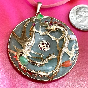 Vintage apple green round jade pendant in 14k gold decked out with bird and dragon rubies, small cabochon different colored jade stones.