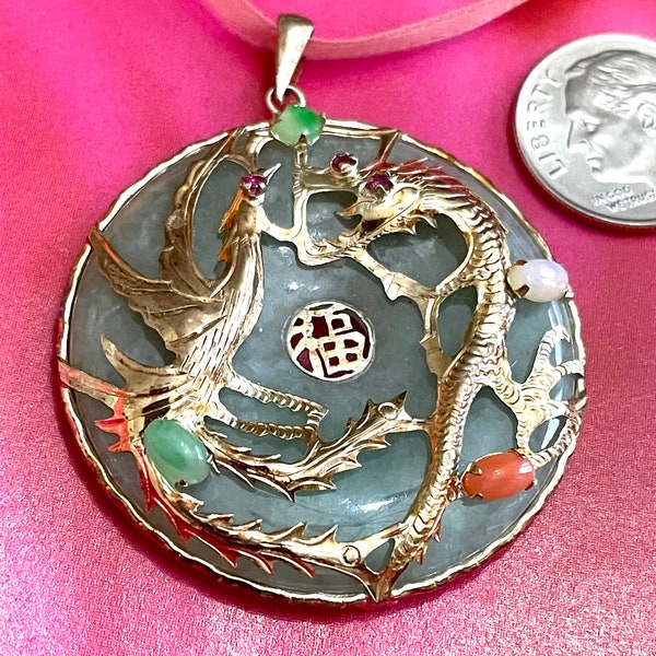 Vintage apple green round jade pendant in 14k gold decked out with bird and dragon rubies, small cabochon different colored jade stones.