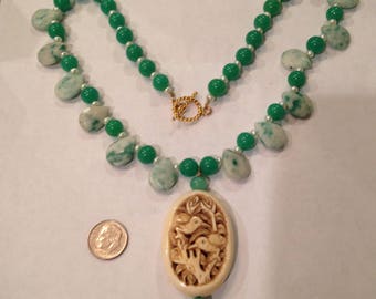 Jade necklace  with Green Jade beads, canadian jade, pearl beads and carved birds on resin. Beautiful necklace
