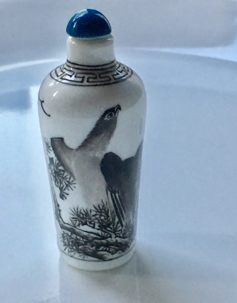 Circa 1960\u2019s Vintage Chinese import hand painted ceramic snuff bottle a scenery of mountains and trees and a big bird In black and white