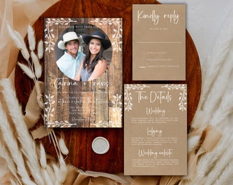 May include: Rustic wedding invitation suite featuring a photo of the couple on a wooden background. The invitation includes details in white script, with RSVP and details cards. The suite is decorated with floral accents.