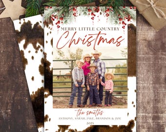 May include: A Christmas card with a rustic theme featuring a family of five in front of a fence. The card has a white background with brown splotches and a green garland with red berries at the top. The text reads "Merry Little Country Christmas" and "The Smiths" with the family members' names listed below. The year 2025 is printed at the bottom.