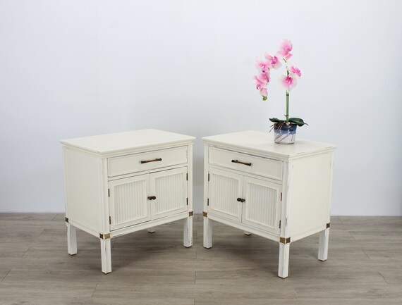 cream dresser and nightstand