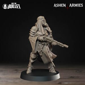 May include: A grey figurine of a soldier in a hooded helmet and armour, holding a rifle. The figure has a respirator mask and a rosary. The words "Bite the Bullet" and "Ashen Armies" are visible.