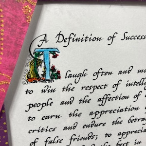 May include: A handwritten definition of success with an illustration of a woman with blue eyes and red flowers. The text reads: "A Definition of Success laugh often and to win the respect of intelligent people and the affection of critics and endure the betrayal of false friends; to appreciate beauty; to find the best in the world a bit better than a healthy child,"