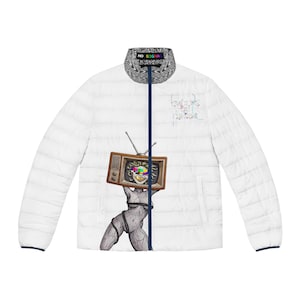 May include: A white puffer jacket with a dark blue central zip and a high collar featuring a black and white marbled pattern with the text NO SIGNAL. The front displays a graphic of a stone-textured figure holding a vintage television set.