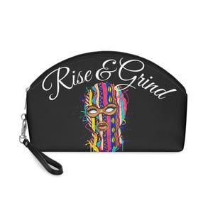 May include: A black semi-circular pouch with a wrist strap featuring the white text Rise & Grind above a colorful graphic of a face wearing a patterned balaclava. The design includes vibrant splashes of yellow, blue, pink, and orange paint.