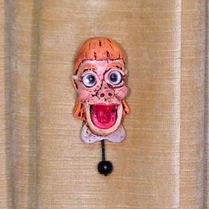 See "CANDY" the amazing 3 inch Pin Head, Ventriloquist’s novelty pin.