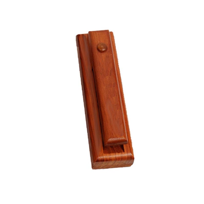 May include: A wooden box with a hinged lid, closed, made of reddish-brown wood. The box has a small brass knob on the top.