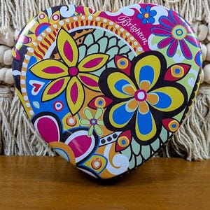 May include: A set of three ceramic mugs with a speckled, matte finish. The mugs are in shades of cream, light brown, and dark brown. Each mug has a simple, minimalist design, perfect for coffee or tea.