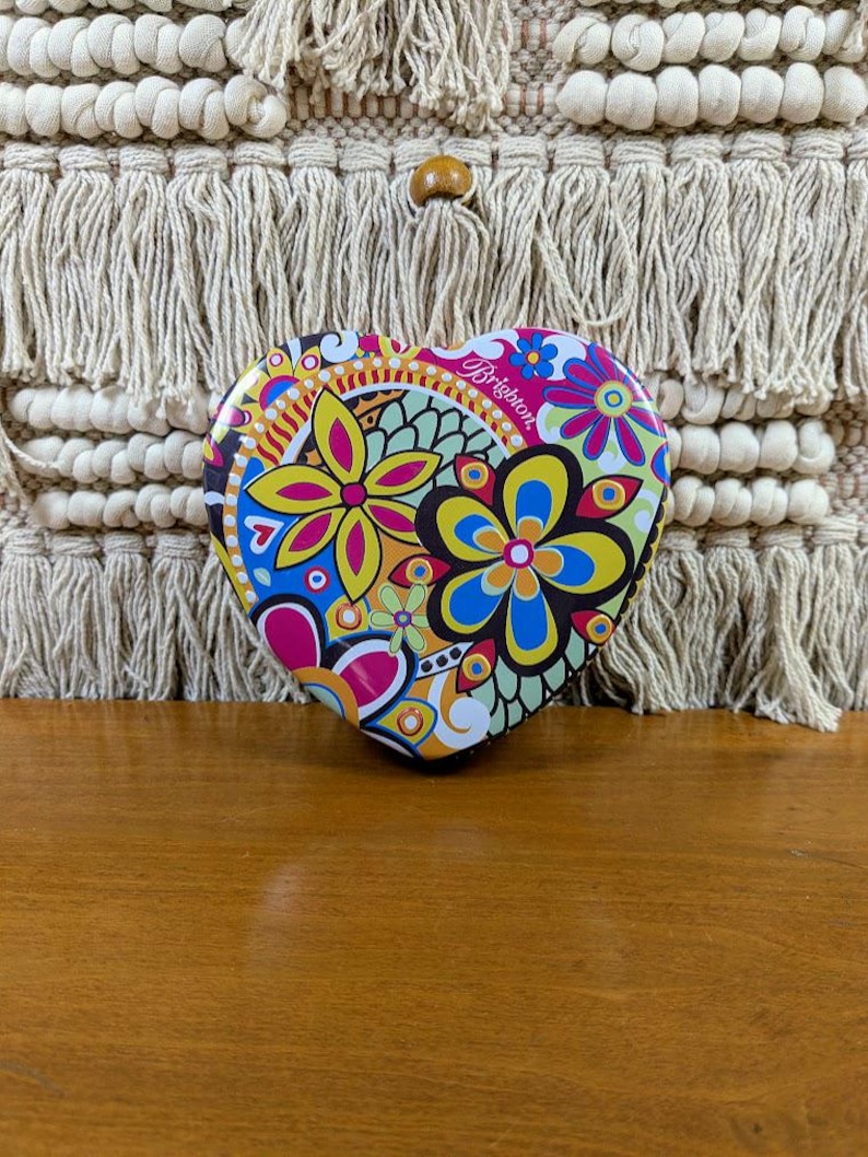 May include: A set of three ceramic mugs with a speckled, matte finish. The mugs are in shades of cream, light brown, and dark brown. Each mug has a simple, minimalist design, perfect for coffee or tea.