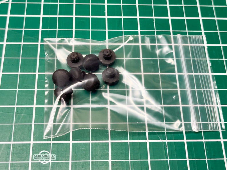 May include: A clear plastic bag containing a set of ten black rubber bumpers.