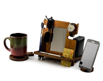 May include: Wooden desktop organizer with a mirror, watch holder, phone stand, pen holder, and sunglasses holder. It also includes a credit card slot and a small tray for keys or other small items.
