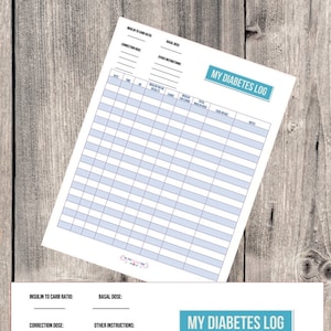 May include: A printable diabetes log with sections for date, time, blood glucose results, carbohydrates, insulin for carbs, total insulin dose, food intake, and notes. The log has a blue and white color scheme and the text "My Diabetes Log" is printed in a blue box.