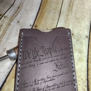Cartera Wickett-Craig de 2 bolsillos grabada con láser con We The People