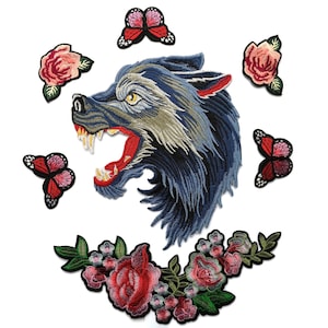 May include: Embroidered iron-on patches featuring a blue wolf head, red roses, and pink butterflies.
