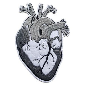 May include: Embroidered patch in the shape of a human heart. The patch features detailed stitching in shades of grey and white, depicting the heart's anatomy. The patch has a white border.