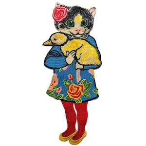May include: Embroidered iron-on patch featuring a black and white cat wearing a blue dress with pink and red flowers, holding a yellow duckling.