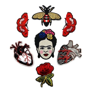 May include: Embroidered patches featuring a bee, butterflies, a Frida Kahlo portrait, anatomical hearts, and a red rose. The patches are colourful with detailed stitching, ideal for decorating clothing or accessories.