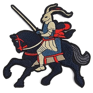 May include: An embroidered patch of a rabbit knight riding a black horse. The rabbit is wearing armor and holding a spear. The patch is perfect for adding a whimsical touch to clothing, bags, or other accessories.