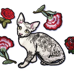 May include: Five embroidered iron-on patches featuring a white hairless cat with a rose tattoo and four red roses.