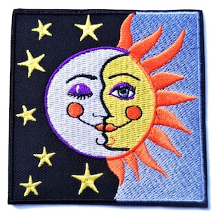 May include: Embroidered patch featuring a whimsical sun and moon with faces, surrounded by yellow stars on a black background. The sun is orange and yellow with a blue eye, while the moon is white with a purple eye. The background is split in half, with the top half being blue.