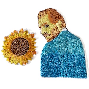 May include: Embroidered patch featuring a sunflower and a portrait of Vincent van Gogh. The sunflower has yellow petals and a brown center. Van Gogh's portrait shows him with orange hair and beard, wearing a blue jacket. The patch is on a white background.