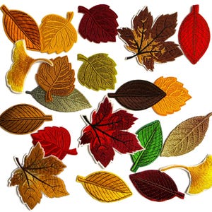 May include: A collection of embroidered leaf patches in various shapes and autumn colours, including shades of red, orange, yellow, brown, and green. The assortment features maple, ginkgo, and oval-shaped leaves with detailed stitching.