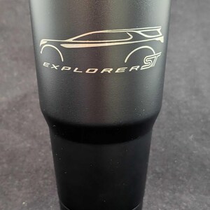 May include: Black 30 ounce tumbler with a white outline of a Ford Explorer ST and the text "Explorer ST".