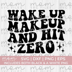 May include: Black and white graphic design with the text "Wake Up Makeup And Hit Zero" in a retro font style. The design includes two small stars on either side of the text.