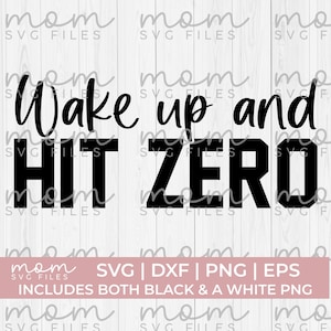 May include: Black and white graphic design with the text "Wake up and HIT ZERO". The design is on a white wood background. The text is in a bold, sans-serif font.