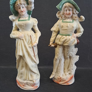FRENCH BISCUIT pair of French biscuit sculptures, richly policrome, 19th century.