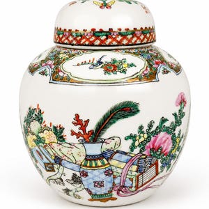 May include: A white ceramic ginger jar with a matching lid, featuring a colorful hand-painted design of floral arrangements, scrolls, a vase, and a peacock feather. The rim of the lid and the shoulder of the jar are decorated with a red lattice pattern.