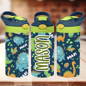 May include: A set of three water bottles with a navy blue background and a dinosaur pattern. The bottles have a green and navy blue lid and the name "MASON" in green. The dinosaur illustrations are in shades of green and orange.