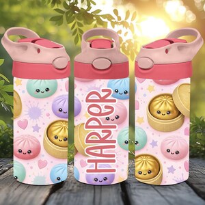 May include: A water bottle with a pink lid and a light pink background featuring a pattern of colorful cartoon bao buns in bamboo steamers, small stars, and hearts. The name HARPER is printed vertically in large, bold, dark pink capital letters.
