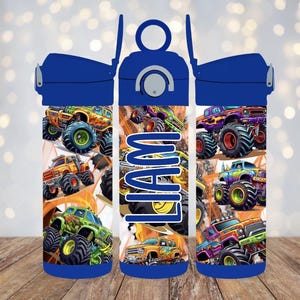 May include: A blue water bottle featuring a colorful monster truck design. The bottle has a blue lid and a handle. The name "LIAM" is printed in white on the bottle. The background is a mix of orange and brown.